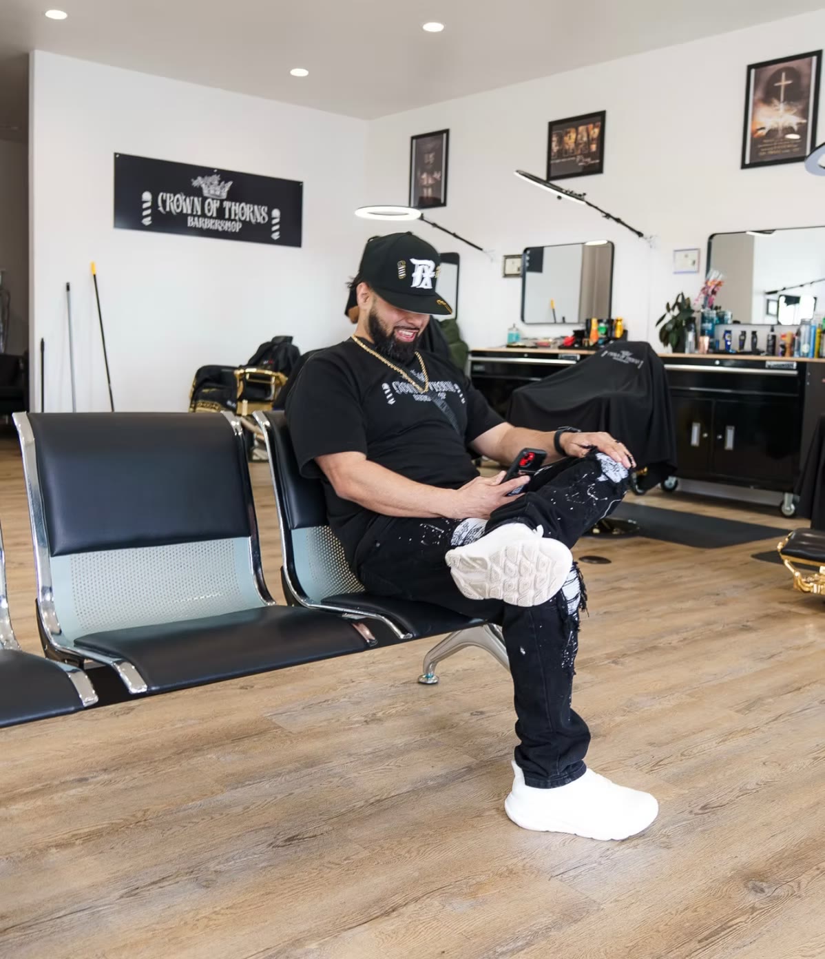 Crown of Thorns founder Michael Reynosa seated in the shop waiting area